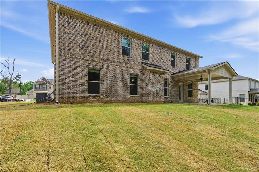 Exterior details and patio area of a home in Cambria at Traditions, Hampton (Image 18).
