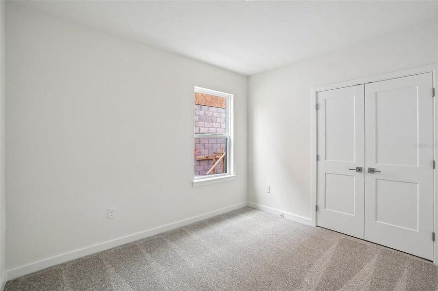 Spacious, unfurnished interior of a new home in Grasslands West, Lakeland (Image 29).