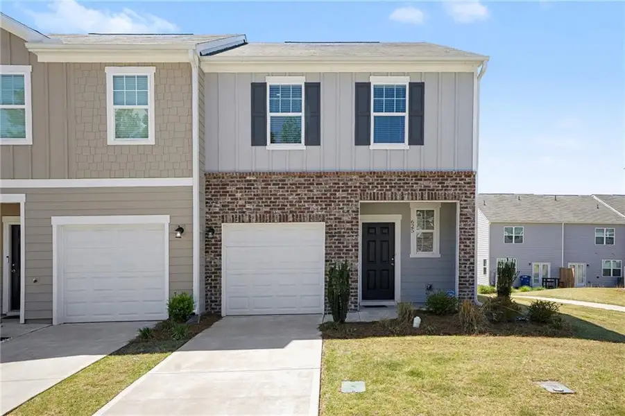 Front exterior of a new home in , Locust Grove, GA, highlighting curb appeal (Image 24).