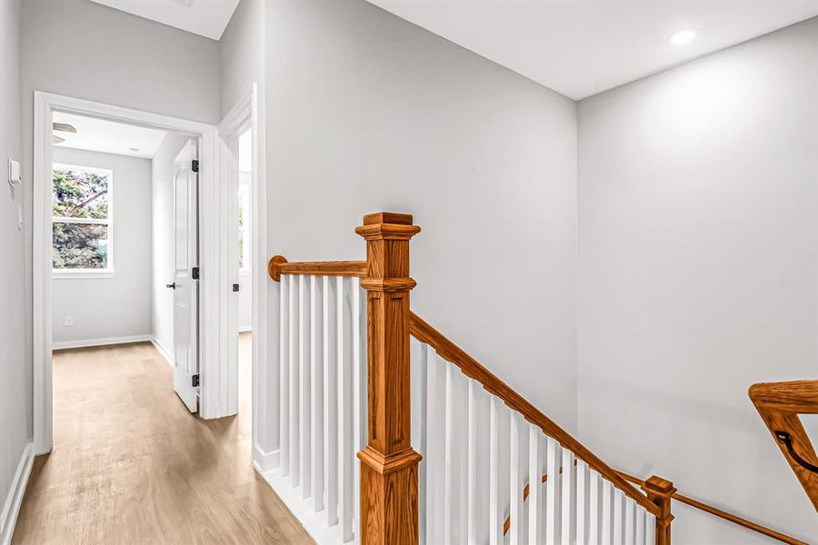 Second floor landing leading to the primary bedroom.