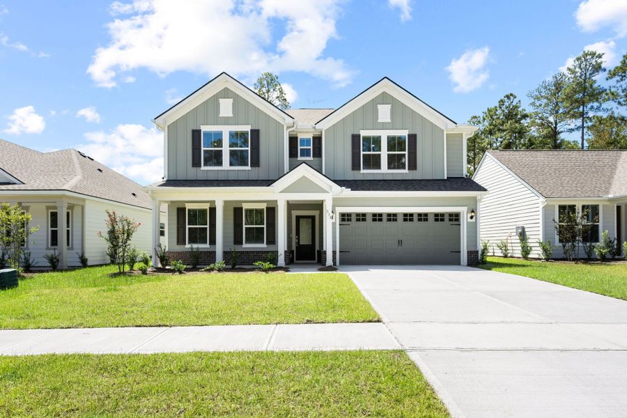 Front exterior of a new home in Waterways, Richmond Hill, GA, highlighting curb appeal (Image 25).