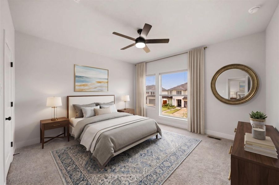 The fourth bedroom offers a comfortable, well-appointed setting with plush carpet, a ceiling fan with integrated light and windows dressed with roller shades for customizable privacy and natural light. This photo has been virtually staged.