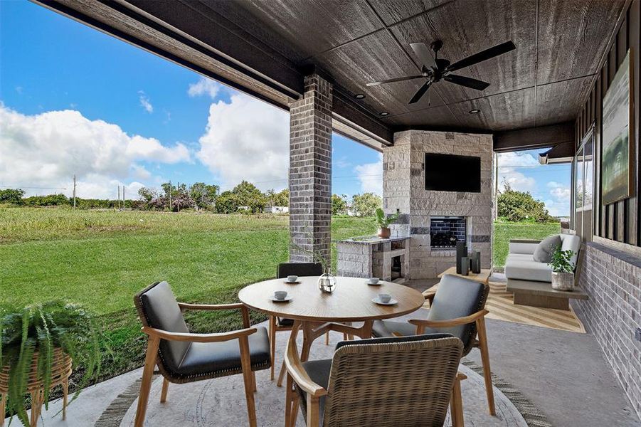 View of patio / terrace with ceiling fan and an outdoor kitchen