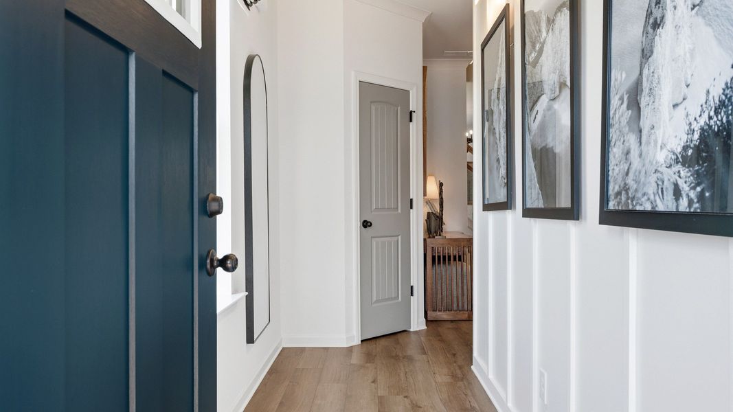 Welcoming entryway with tall ceilings, modern trim, and natural light in Langley Overlook townhome in Loganville, GA.