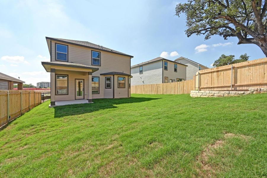 Exterior details and patio area of a home in Creekside at Estancia, Austin (Image 21).