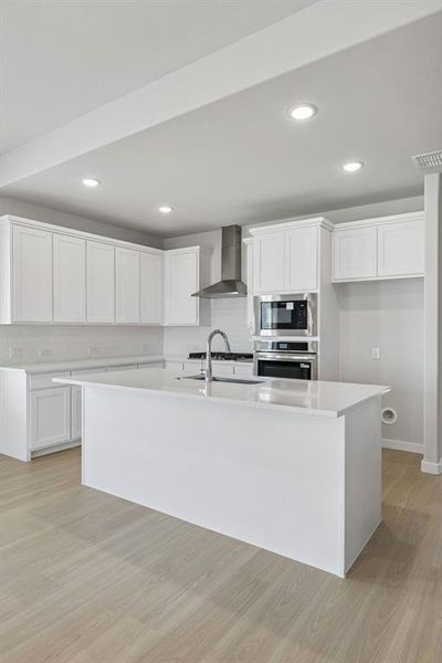 Kitchen in the Stanley II home plan by Trophy Signature Homes – REPRESENTATIVE PHOTO