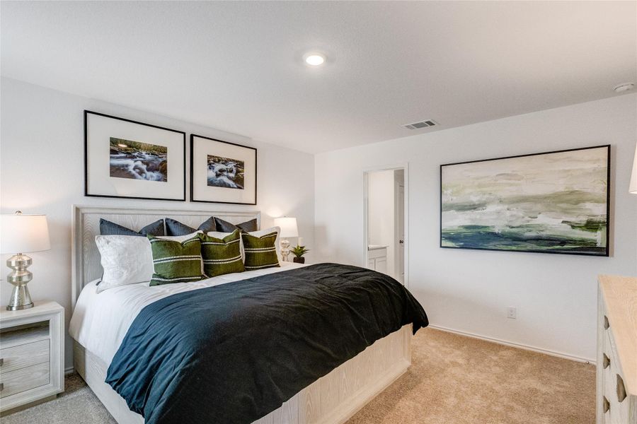 Bedroom with light carpet and baseboards Bedroom with light carpet and baseboards