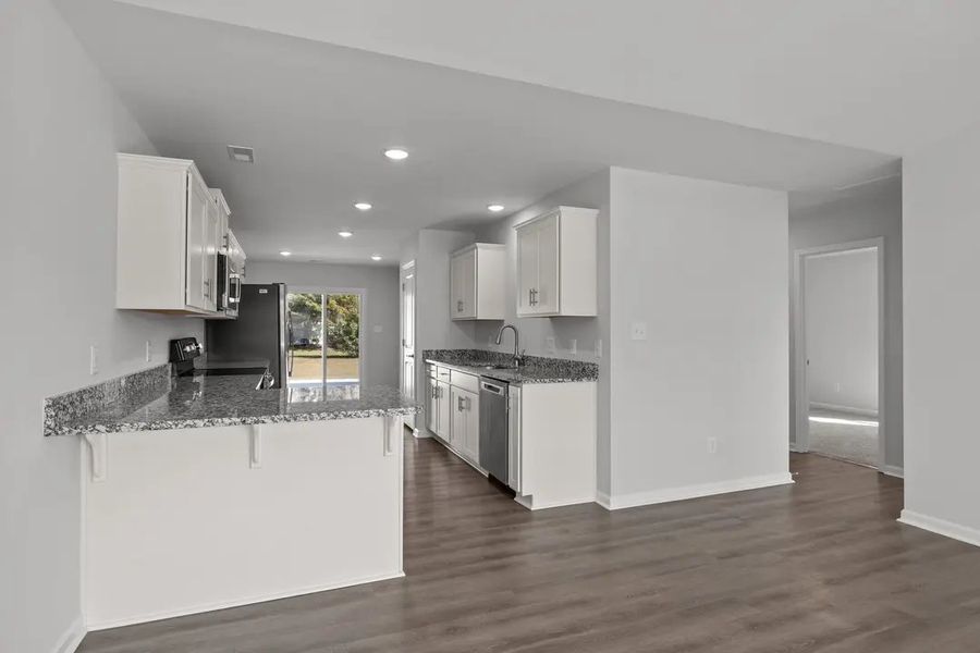 Furnished interior in a model home at The Villas in Newport (Image 7).