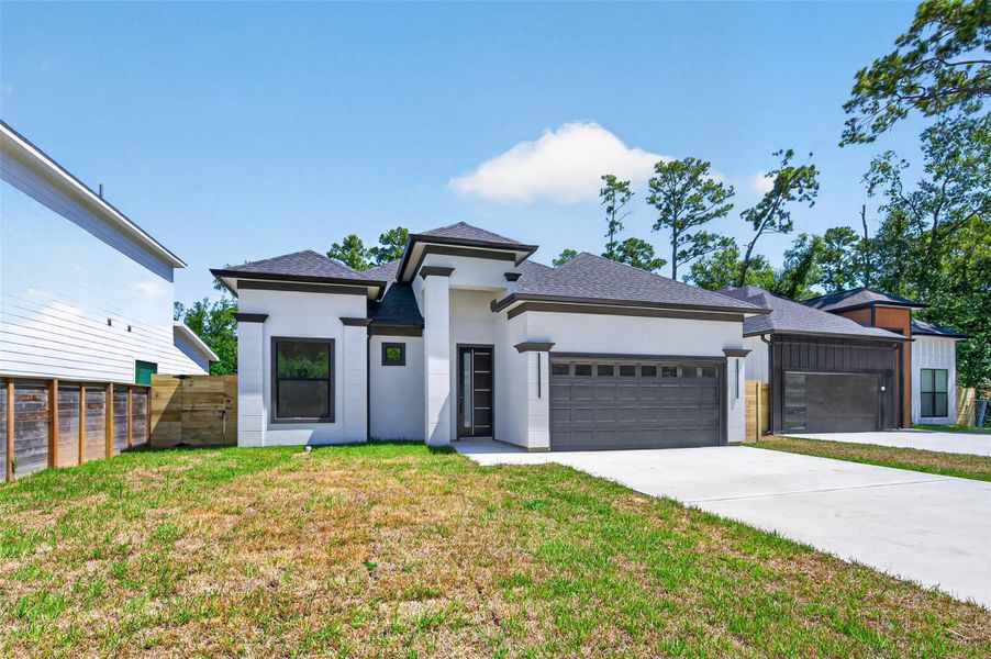 Front exterior of a new home in , Conroe, TX, highlighting curb appeal (Image 27).