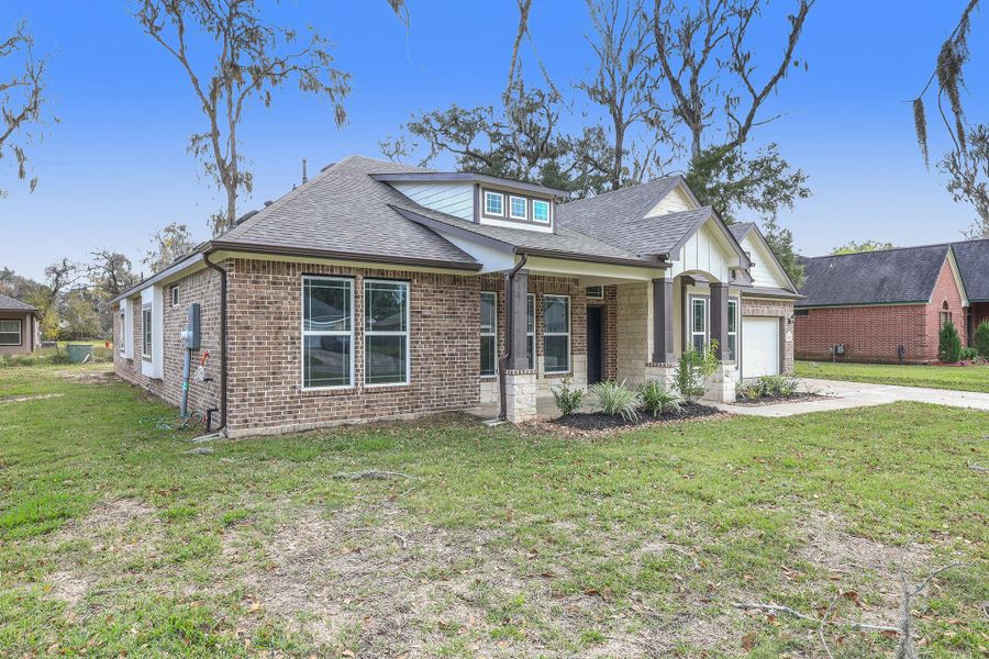 Front exterior of a new home in , West Columbia, TX, highlighting curb appeal (Image 13).