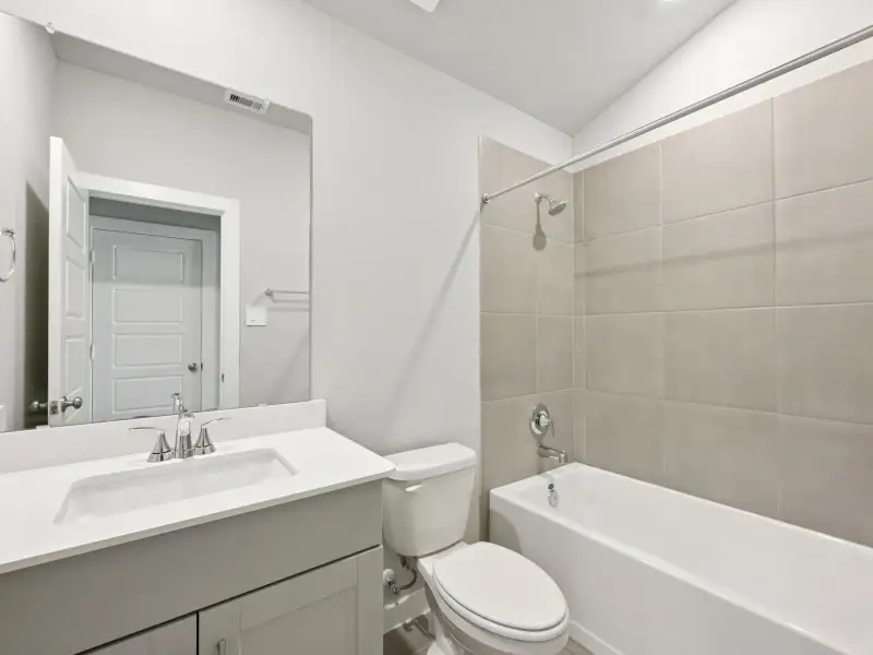 Furnished interior view inside a new home in Sanford Farms - Premier Series, Waller (Image 7).