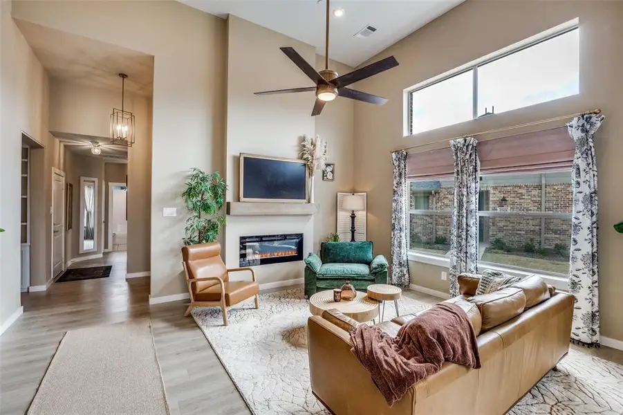 Cozy Living Area with plenty of natural light and Electric Fireplace