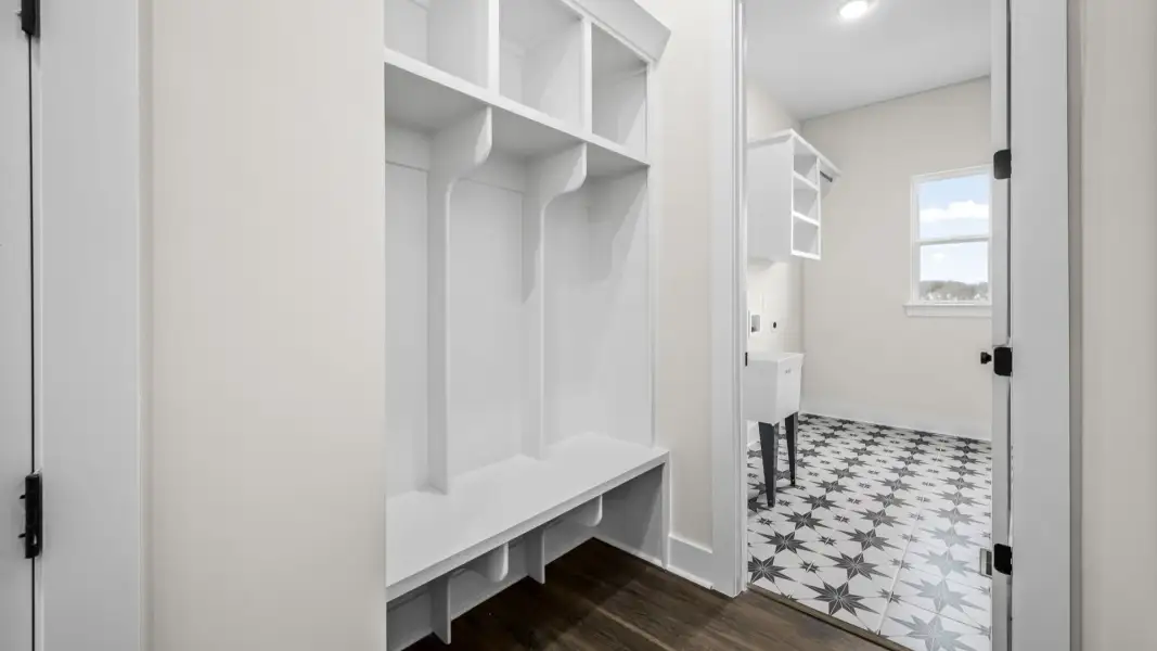Functional drop zone area next to dedicated laundry room