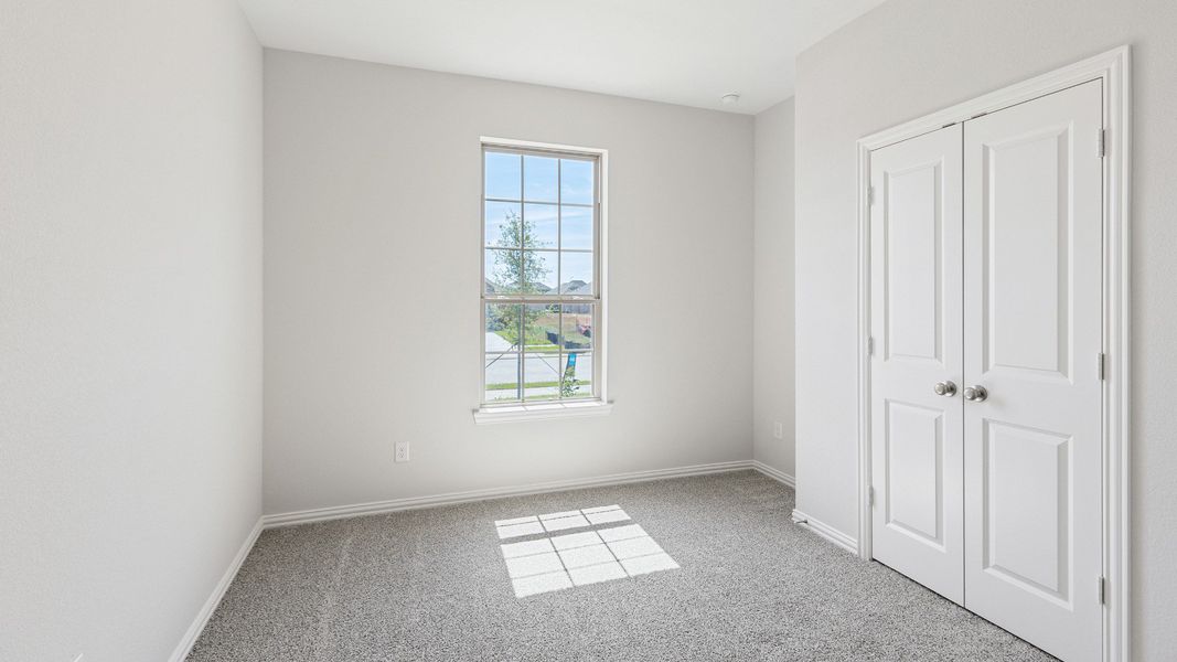 Furnished interior view inside a new home in Sunterra, Katy (Image 9).