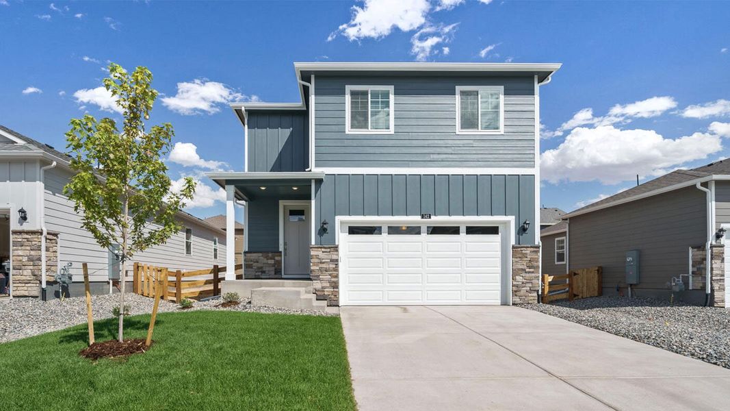 Front exterior of a new home in Prairie Song, Windsor, CO, highlighting curb appeal (Image 1). Front exterior of a new home in Prairie Song, Windsor, CO, highlighting curb appeal (Image 1).