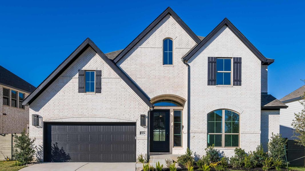 Front exterior of a new home in Wolf Ranch 56', Georgetown, TX, highlighting curb appeal (Image 19).
