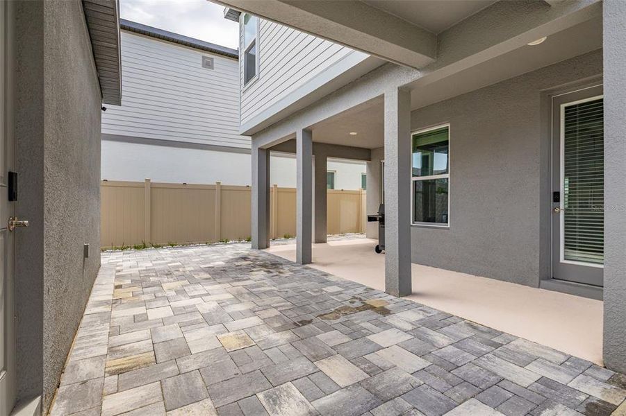 Exterior details and patio area of a home in Highland Ridge, Winter Garden (Image 29).