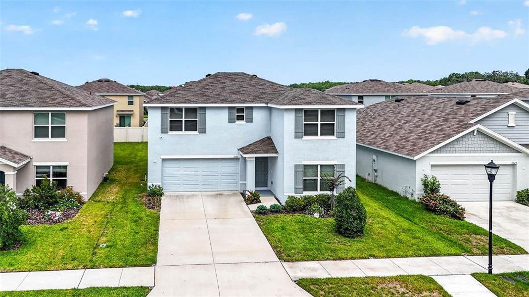 Front exterior of a new home in , Tampa, FL, highlighting curb appeal (Image 27).