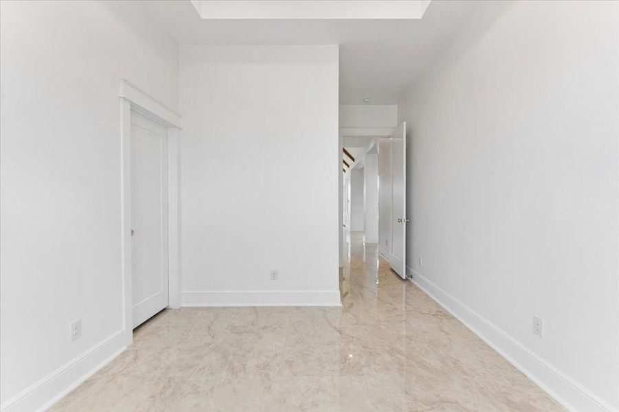 Alternate view of the bedroom showcasing the spacious layout and closet area. Alternate view of the bedroom showcasing the spacious layout and closet area.