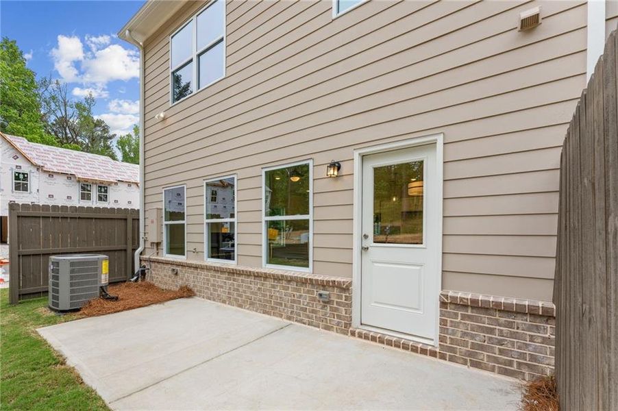 Exterior details and patio area of a home in River Walk Place, Lawrenceville (Image 19).