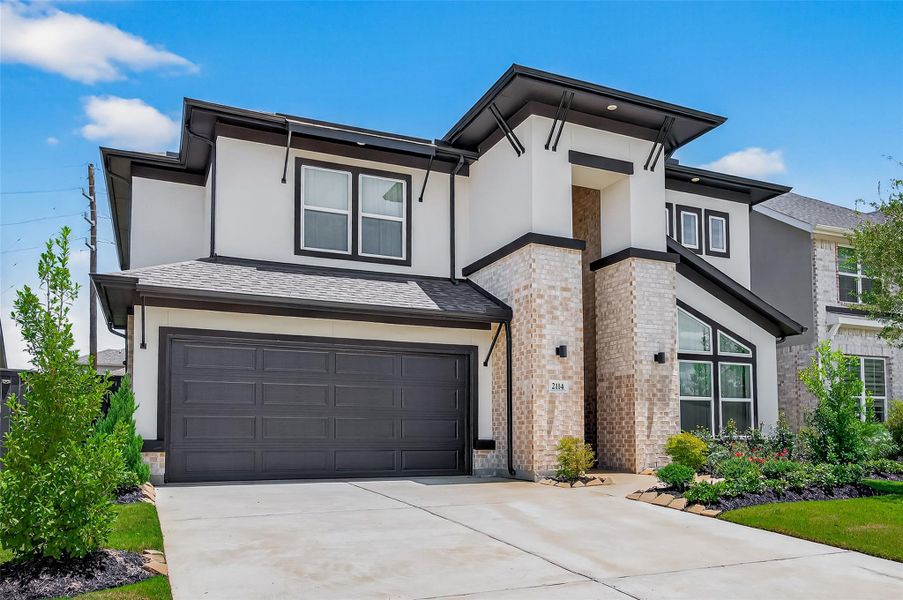 Front exterior of a new home in , Richmond, TX, highlighting curb appeal (Image 1). Front exterior of a new home in , Richmond, TX, highlighting curb appeal (Image 1).
