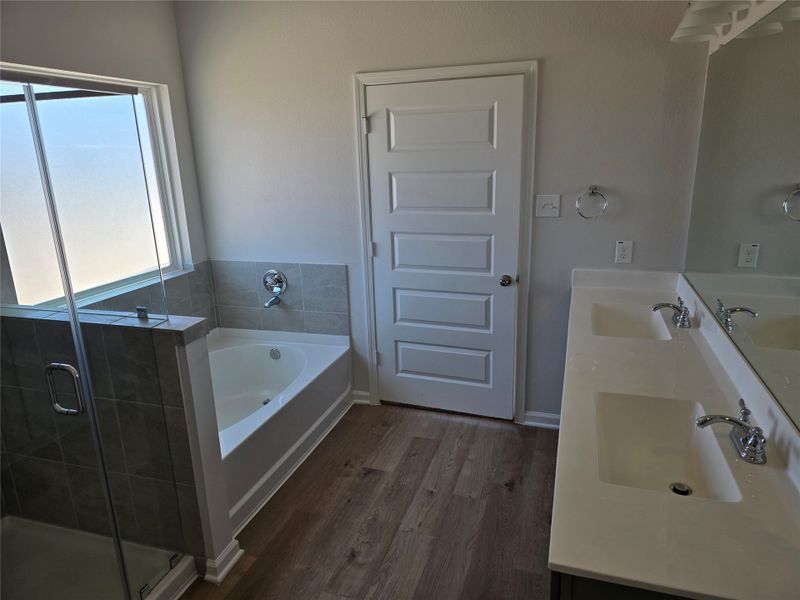 The Shetland III- Primary Bathroom with dual sinks, garden tub and separate shower. included). Home under construction, photo used for illustrative purposes only, colors and options will vary. The Shetland III- Primary Bathroom with dual sinks, garden tub and separate shower. included). Home under construction, photo used for illustrative purposes only, colors and options will vary.