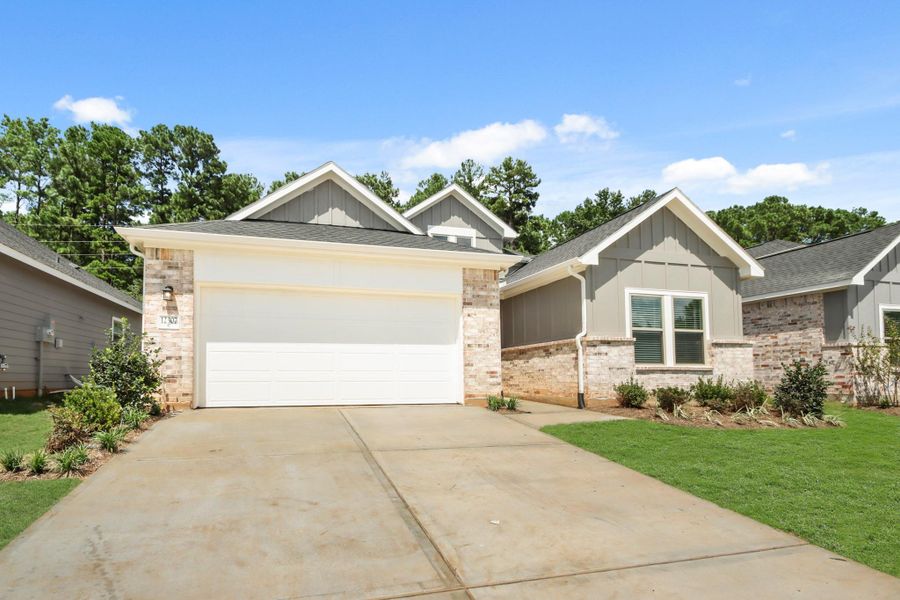 Front exterior of a new home in Westridge Cove 40', Conroe, TX, highlighting curb appeal (Image 14).