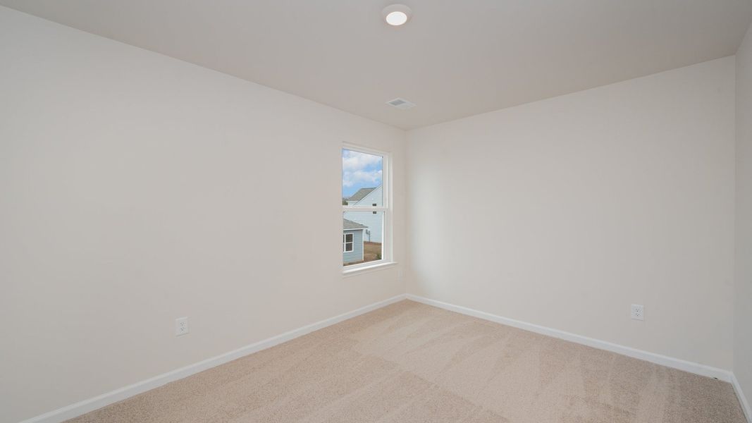 Spacious, unfurnished interior of a new home in Indigo Preserve, Leland (Image 26).