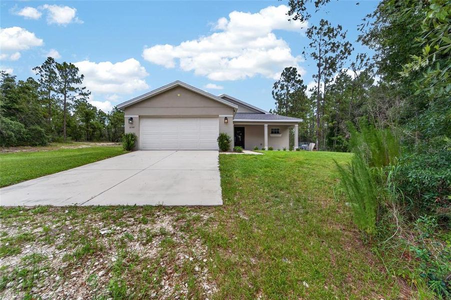 Front exterior of a new home in , Brooksville, FL, highlighting curb appeal (Image 22).