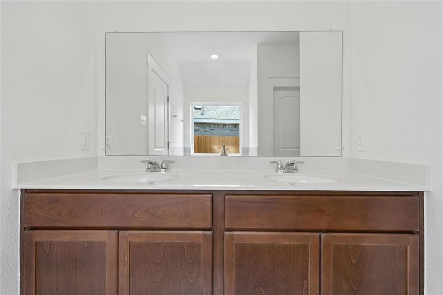 Bathroom featuring double vanity Bathroom featuring double vanity
