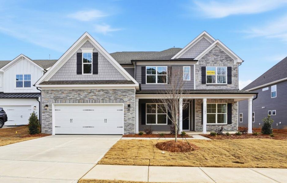 Front exterior of a new home in Carrington, Stanley, NC, highlighting curb appeal (Image 2). Front exterior of a new home in Carrington, Stanley, NC, highlighting curb appeal (Image 2).