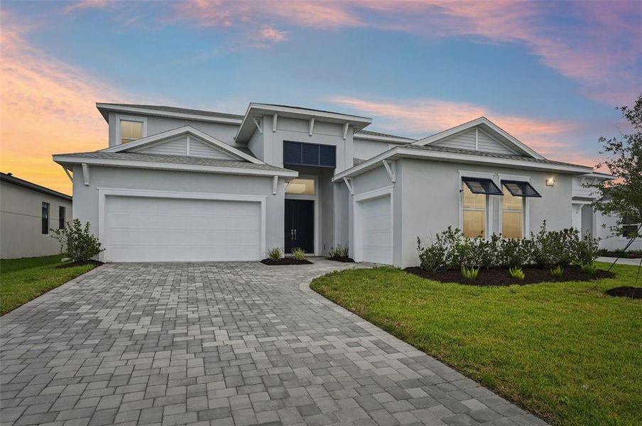 Front exterior of a new home in Biscayne Landing at Seaire, Parrish, FL, highlighting curb appeal (Image 21).
