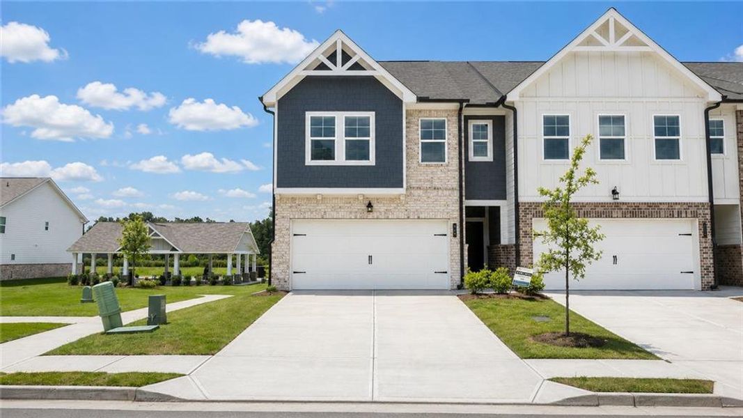 Front exterior of a new home in Union Village, McDonough, GA, highlighting curb appeal (Image 23). Front exterior of a new home in Union Village, McDonough, GA, highlighting curb appeal (Image 23).