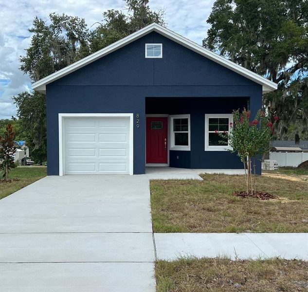 Front exterior of a new home in , Eustis, FL, highlighting curb appeal (Image 1). Front exterior of a new home in , Eustis, FL, highlighting curb appeal (Image 1).