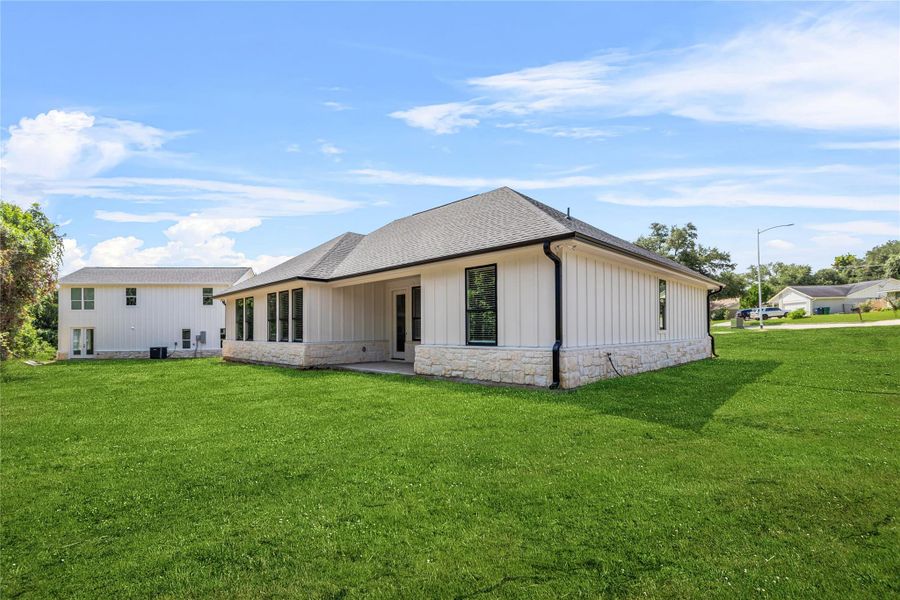 Front exterior of a new home in , Brenham, TX, highlighting curb appeal (Image 1).