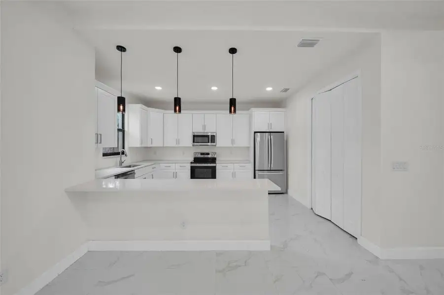 Furnished interior view inside a new home in , Port Charlotte (Image 4).