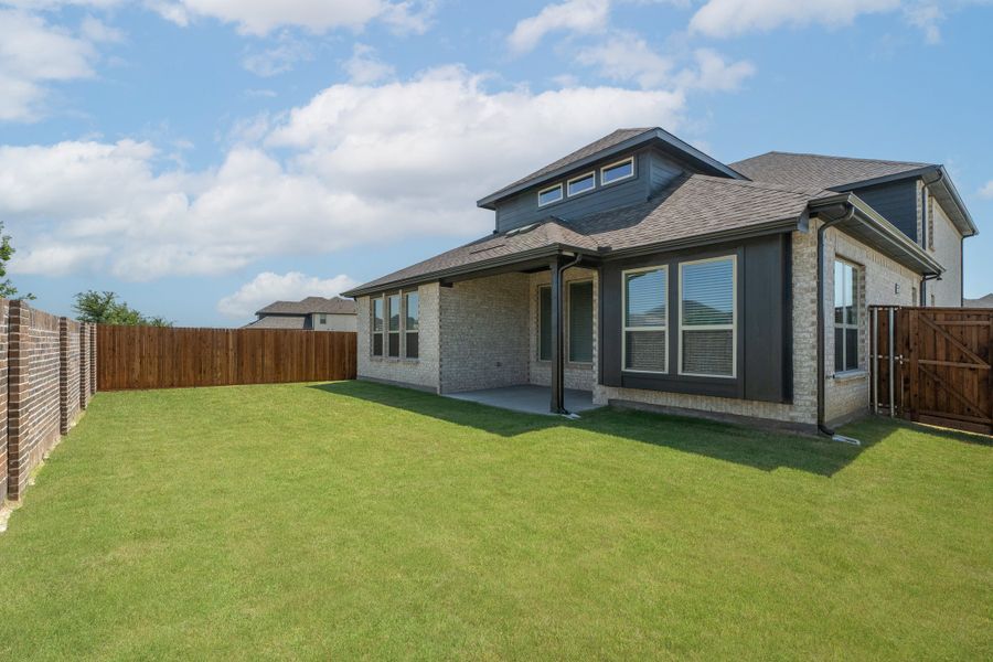 Exterior details and patio area of a home in Valencia on the Lake, Little Elm (Image 2).