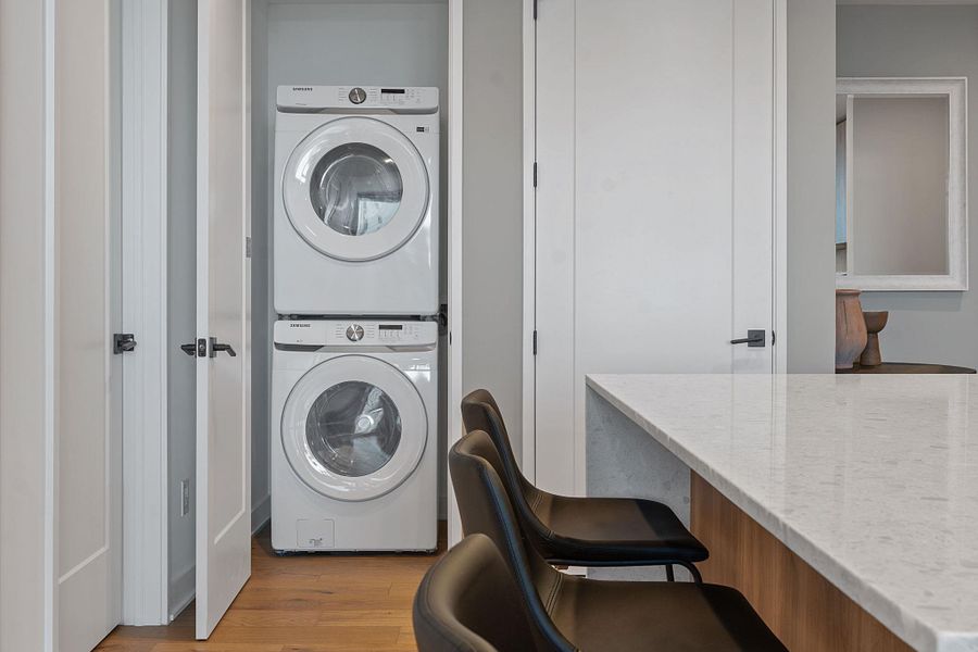 Representative Photo. Laundy closet with Samsung washer and dryer included in unit