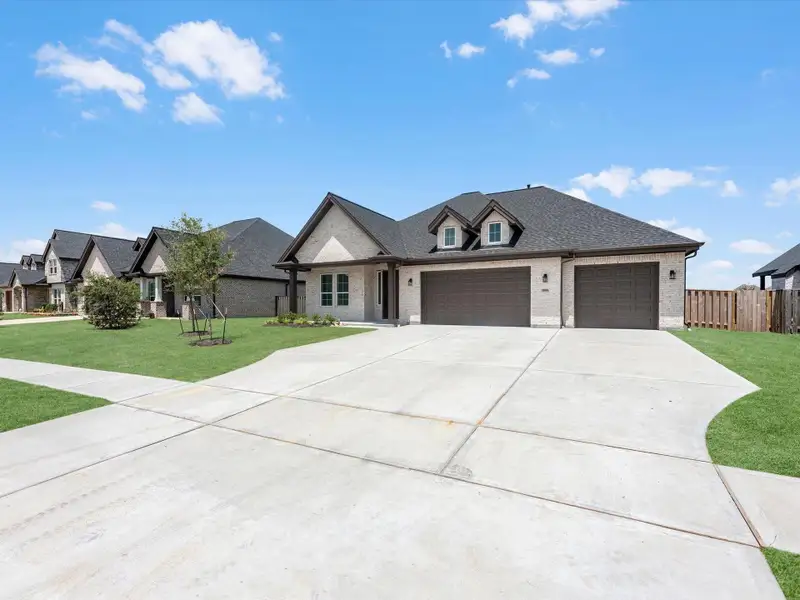 A true 3- car driveway to accompany the 3- car garage. A true 3- car driveway to accompany the 3- car garage.