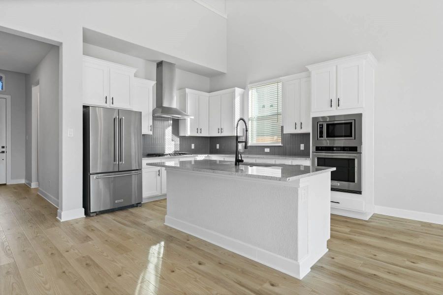 Gorgeous, open kitchen with all stainless steel appliances and plenty of counter space.
