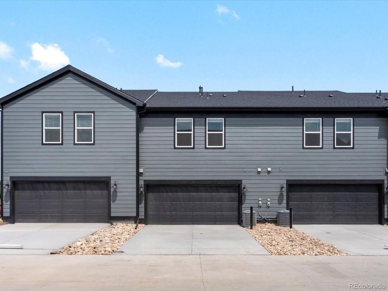 Front exterior of a new home in Poudre Heights: The Meadow Collection, Windsor, CO, highlighting curb appeal (Image 2).