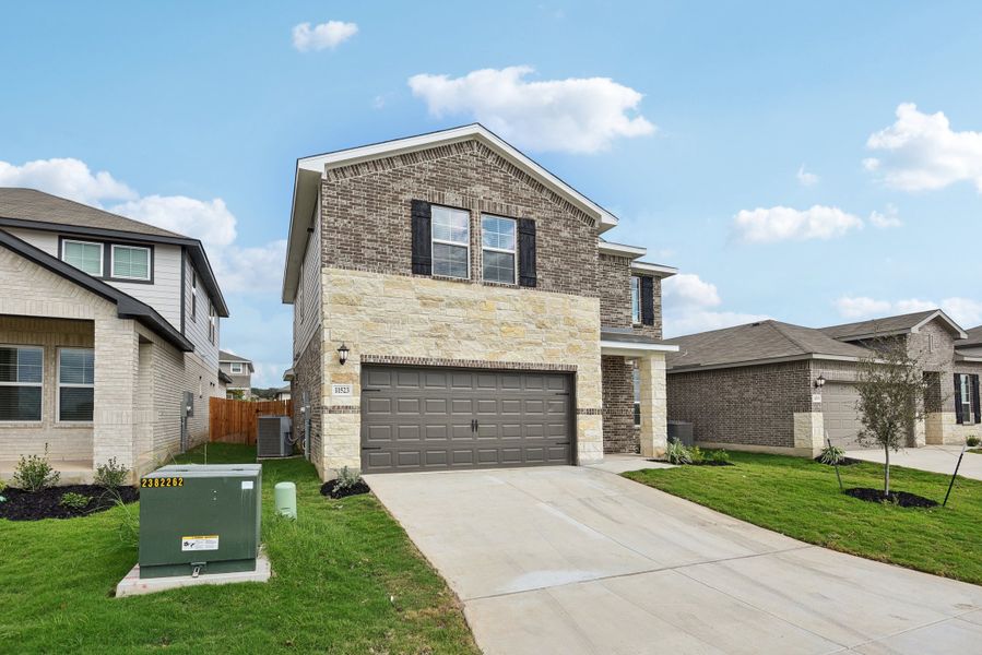 Front exterior of the Medina floorplan at a Meritage Homes community.