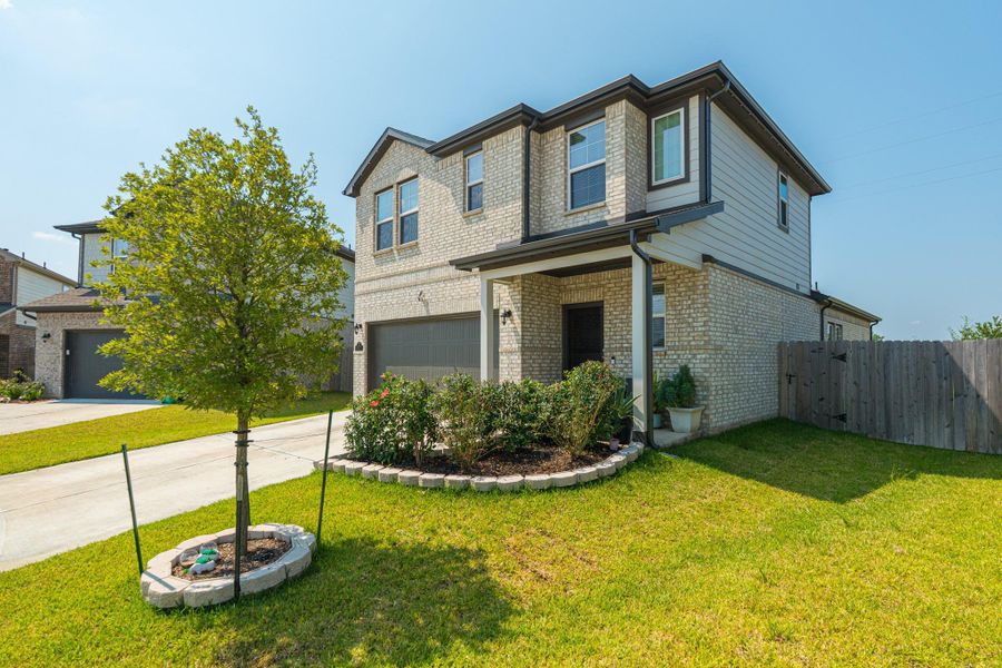 Front exterior of a new home in Lonestar Collection at Aurora, Katy, TX, highlighting curb appeal (Image 19). Front exterior of a new home in Lonestar Collection at Aurora, Katy, TX, highlighting curb appeal (Image 19).