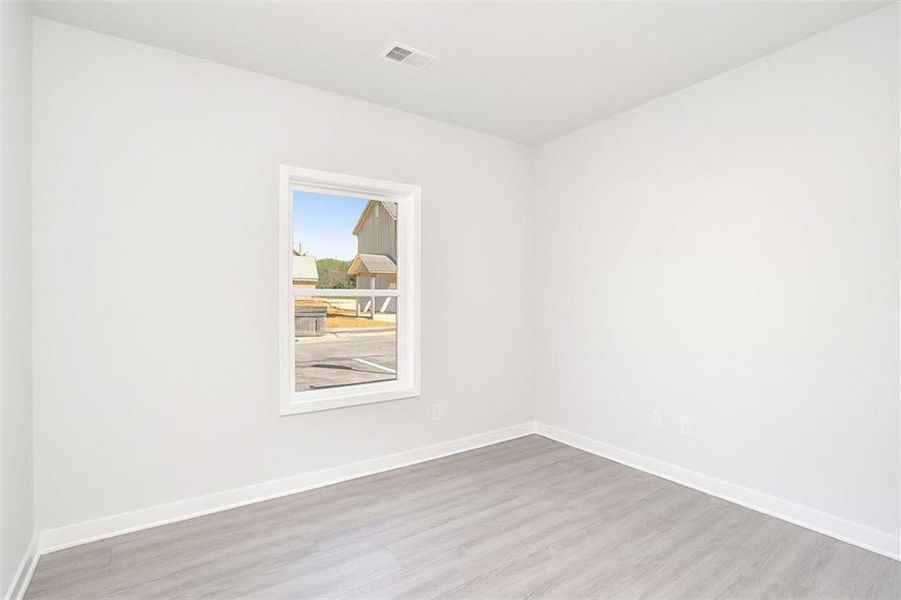 Spacious, unfurnished interior of a new home in The Cottages at East Lanier, Fayetteville (Image 10).