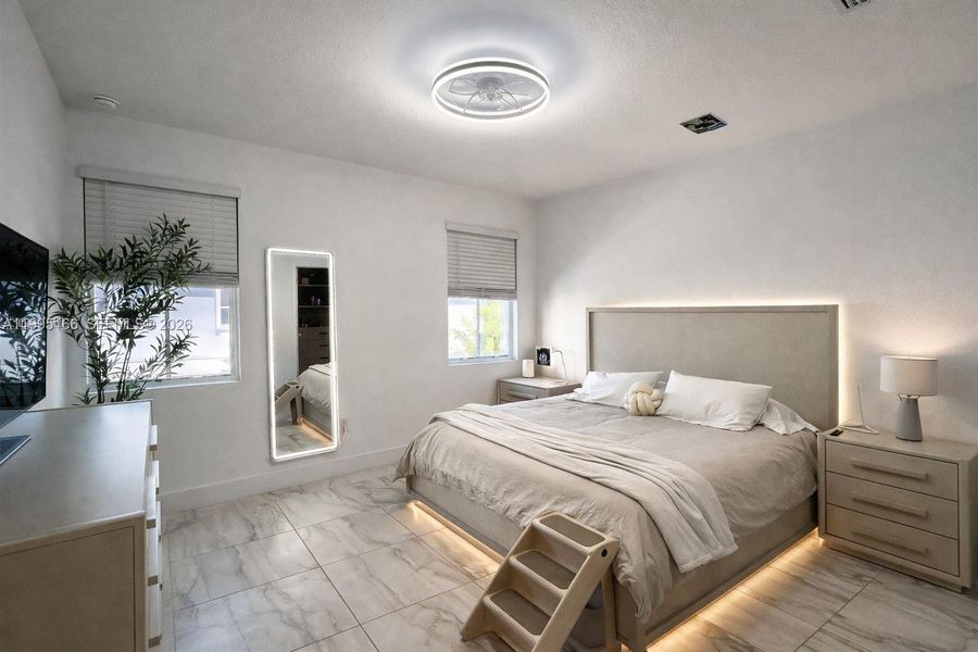 Spacious primary suite with abundant natural light Spacious primary suite with abundant natural light