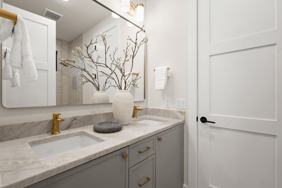 Full bathroom featuring double vanity