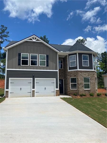 Front exterior of a new home in Twin Oaks, Villa Rica, GA, highlighting curb appeal (Image 12).