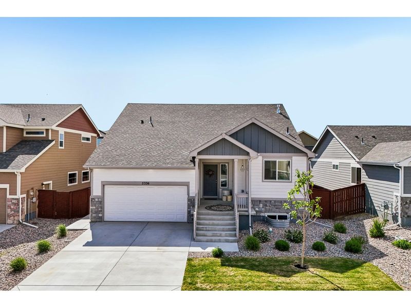 Front exterior of a new home in , Windsor, CO, highlighting curb appeal (Image 22).