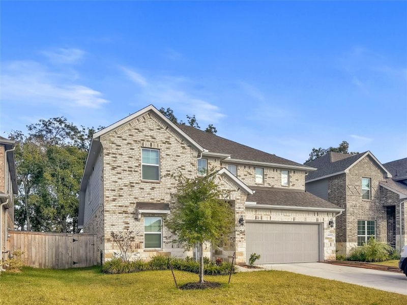Front exterior of a new home in Creekside Farms, Richmond, TX, highlighting curb appeal (Image 2).