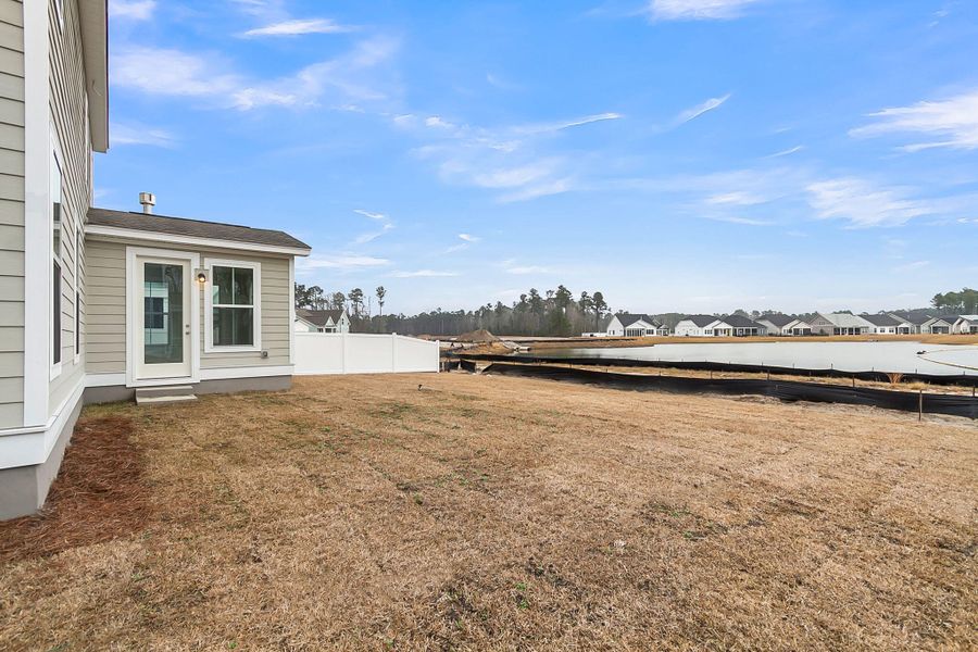 Exterior details and patio area of a home in Tidewater at Lakes of Cane Bay, Summerville (Image 4).